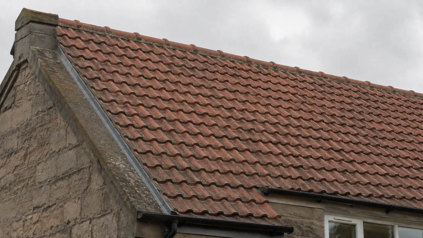 Grey tiled roof on a Scottish stone property